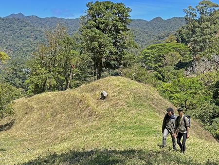Chef Kristen Kish and restaurant owner and Chef Rolando Chamorro hike up a mountain while foraging for ingredients they will use to prepare a meal at his restaurant in Hacienda Mamecillo, Boquete, Panama. (National Geographic for Disney/Missy Bania)