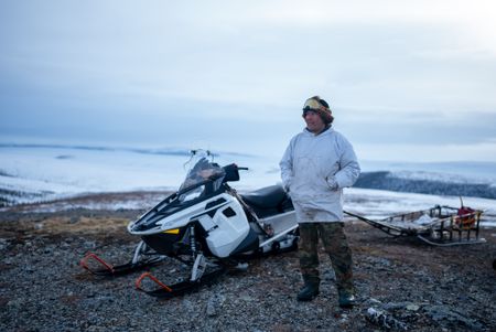 Chip Hailstone prepares  his snowmobile to travel to a nearby location to build a bird blind during the early spring migration. (BBC Studios Reality Productions/Ashton Hurlburt)