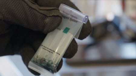 A CBP officer uses a narcotics test kit to test a suspicious substance found in a passenger's luggage. in El Paso, Texas. (National Geographic)