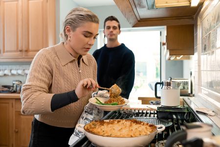 Florence Pugh plates the Shepherd's Pie as Antoni Porowski looks on. (National Geographic/Chris Raphael)