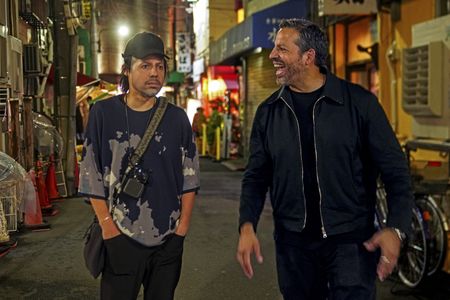 David Blaine laughs as Amazing Jiro walks through Tokyo wearing the mask of David's face. (credit: National Geographic/Dana Hayes)