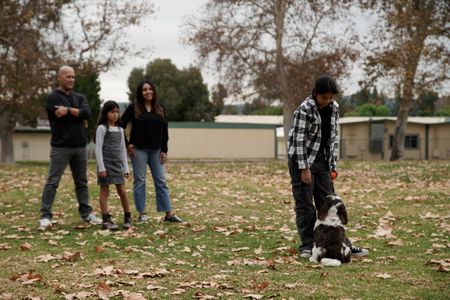 The Hernandez family with Lucy in the park. (National Geographic)