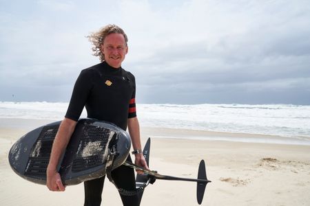 Christian Bungate with his foil board at Cabarita Beach. (National Geographic/Justine Kerrigan)