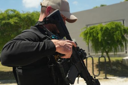 CBP AMO Agent Berger prepares his weapon before going out on a mission.  in Fajardo, P.R. (Lucky 8 TV/Ivan Leon)