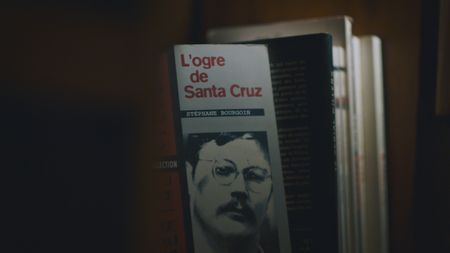 The book "L'Ogre de Santa Cruz," authored by Stéphane Bourgoin, is pictured during the production of "Killer Lies: Chasing a True Crime Con Man," a documentary series about obsession and deception, following the unraveling of Stephane Bourgoin’s career as a best-selling author and serial killer expert. (National Geographic)