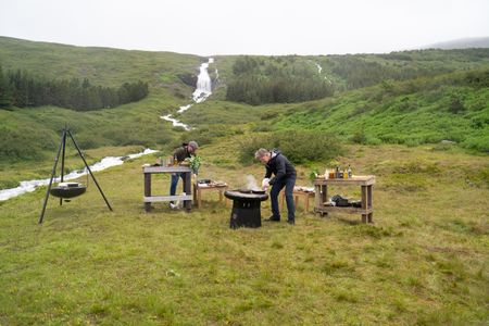 Iceland - Rain falls as Chef, Ragnar Eiríksson (L) and Gordon Ramsay work on their dishes during the final cook in Iceland. (Credit: National Geographic/Justin Mandel)