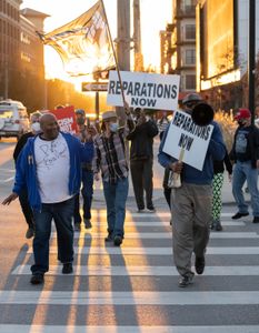 Protestors led by Rev. Robert Turner march through Tulsa, OK and call for reparations for victims of the 1921 Tulsa Race Massacre. (National Geographic/Christopher Creese)