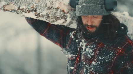 Matty finds a heavy log as an achor for his ice-fishing shed. (Blue Ant Media/Tara Elwood)