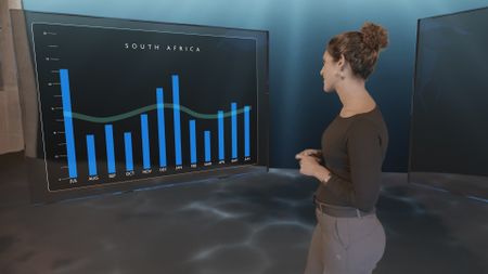 Dr. Diva Amon next to a GFX chart of South Africa shark attacks and the variation depending on the month. (National Geographic)
