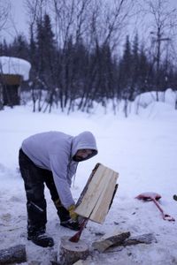 Tig Strassburg chopping wood for winter. (National Geographic/Wayne Shockey)