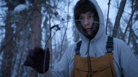 Ricko DeWilde sets snares along his trapline in hopes of catching prime winter fur animals. (BBC Studios/Ryan Walsh)