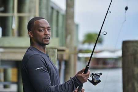 Anthony Mackie fishing for baby Bull Sharks from a dock on of Lake Pontchartrain - Slidell, Louisiana. (National Geographic/Brian Roedel)