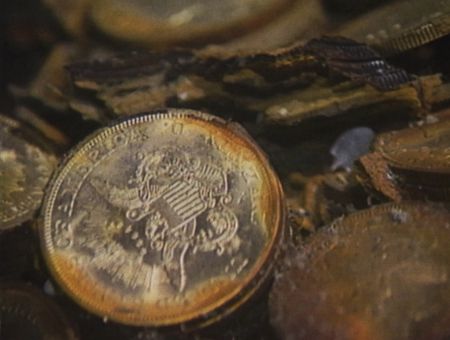 Gold coins are pictured on the bottom of the seabed off the coast of North Carolina, USA. In 1989, maverick scientist Tommy Thompson stuns the world by recovering three tons of gold from a shipwreck deep in the Atlantic Ocean. What follows is a 30-year story of adventure, deception, and personal turmoil, taking him from venerated celebrity to infamous fugitive, and finally a defiant prisoner who refuses to give up his gold. (Recovery Limited Partnership Liquidating Trust)