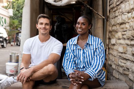 Antoni Porowski and Issa Rae sit at the market in Dakar, Senegal. (National Geographic/John Wendle)