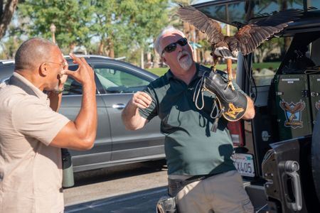 Christian Cooper meets with expert falconer, Ken Miknuk, and his trusty sidekick, Bond, a trained Harris’ Hawk at a park in Palm Desert, CA. (National Geographic/Jon Kroll)