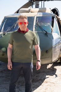 Gordon Ramsay poses in front of a helicopter. (National Geographic/Justin Mandel)