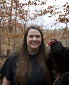 Jenna Penland holiding George the Vulture. (Big Wave Prodcutions)