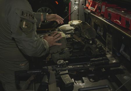 An HSI Agent in the artillery room goes through weapons and supplies in Fajardo, P.R. (Lucky 8 TV/Ivan Leon)