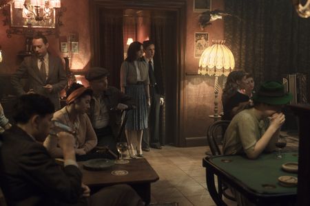 A SMALL LIGHT - Miep and Cas, played by Bel Powley and Laurie Kynaston, go to a bar to look for Jan, as seen in A SMALL LIGHT. (Credit: National Geographic for Disney/Dusan Martincek)
