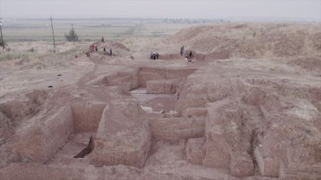 Michael Danti, William Hafford and John Macginnis observe the active dig site in Nimrud, Iraq. (Windfall Films)