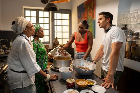 Marie Caroline, Abi Diedhiou, Issa Rae and Antoni Porowski prepare the ceere mboum, a traditional Senegalese dish. (National Geographic/John Wendle)