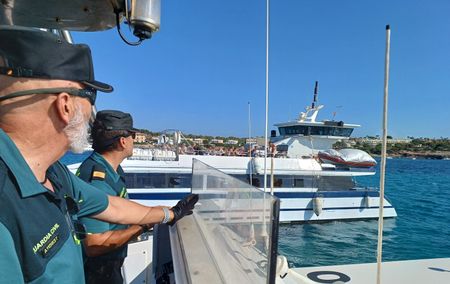 Two guards prepare for an inspection on a "party boat." (National Geographic/Jose Antonio Gavilán Tobal)