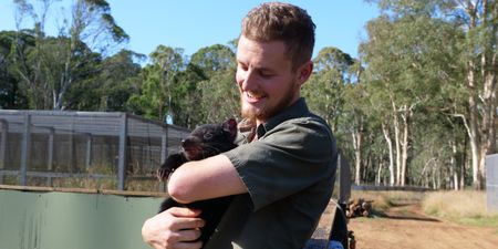 Tyler holding a tasmanian devil baby. (Big Wave Productions)