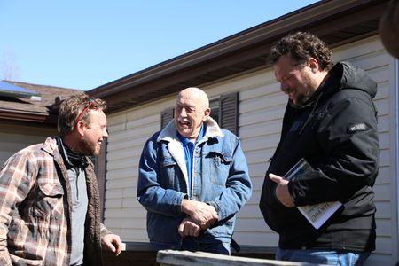 Ben Reinhold, Dr. Pol, and Charles Pol discuss their plans for the Pol family farm's new lambing pen, where the merino sheep will give birth. (National Geographic)