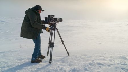 Wildlife photographer Bob Landis films in Yellowstone National Park. (National Geographic/Rick Smith)