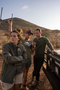 Emma De Jager, Ruan Pretorius, and Giles Clark search for Elektra the pangolin using radio telemetry. (National Geographic/Mark Challender)