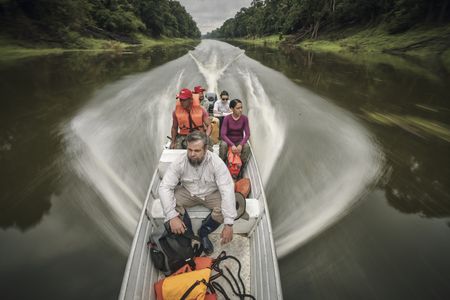 National Geographic Explorer Thiago Silva and his team travel by boat to a forest plot to scan it with LIDAR technology. (Photo:  National Geographic/Pablo Albarenga)