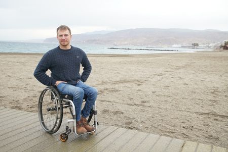 Arthur Williams talks about the Spanish Civil War, at Almeria beach, in Spain. (National Geographic/Ciaran Henry)