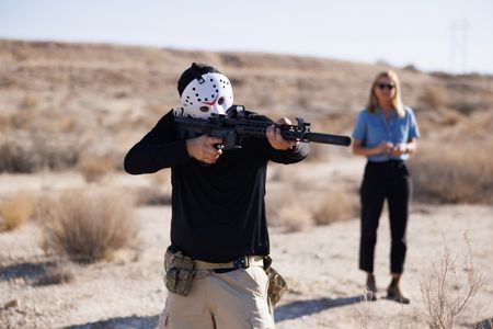 Mariana van Zeller watches as Dutch aims down the sights of unloaded 3D printed weapon. (Credit: National Geographic)