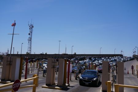 Multiple vehicles wait in line to cross at the El Paso border in El Paso, Texas. (National Geographic)