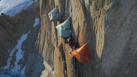 Three tents pitched high on the pool wall.  (photo credit: National Geographic/Simon Niblet)