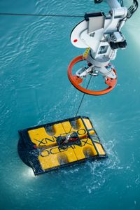An ROV is lifted out of the water. (National Geographic/Mario Tadinac)