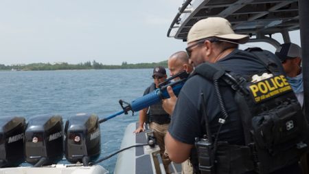 Multiple AMO agents run a practice vessel boarding operation in Fajardo, Puerto Rico. (National Geographic)