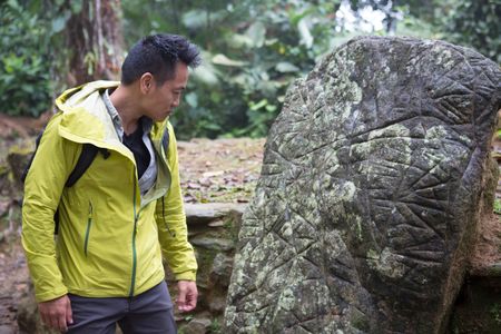 Ciudad Perdida, Colombia - Dr. Albert Lin looking at Ciudad Perdida's map stone. (Blakeway Productions/National Geographic)