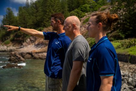 Charlie Huveneers, Adam Barnett, and Lauren Meyer survey Headstone Bay in search of Tiger Sharks. (National Geographic/Sophy Crane)