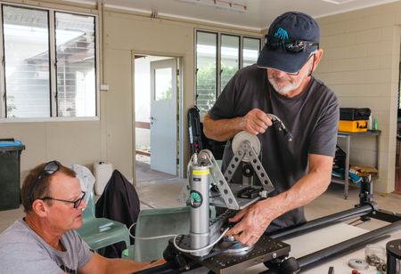 Dive supervisor, Jaap Barendrecht, and cinematographer, Rory McGuinness, building the specialist remote camera system at the Lizard Island Research Station on the Great Barrier Reef.  (photo credit: National Geographic/Harriet Spark)