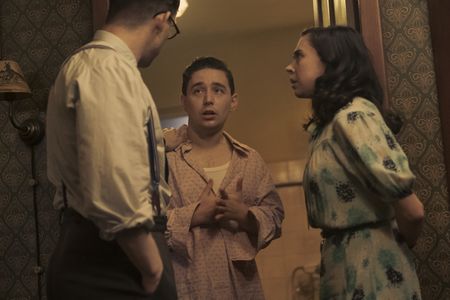 A SMALL LIGHT - Jan and Miep console Kuno as seen in A SMALL LIGHT. (From left: Joe Cole and Jan Gies, Preston Nyman as Kuno, and Bel Powley as Miep Gies). (Credit: National Geographic for Disney/Dusan Martincek)