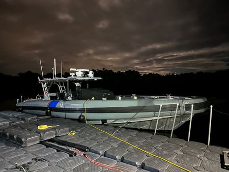 A CBP AMO boat is pictured parked at a dock at night Fajardo, P.R. (Lucky 8 TV/Ivan Leon)