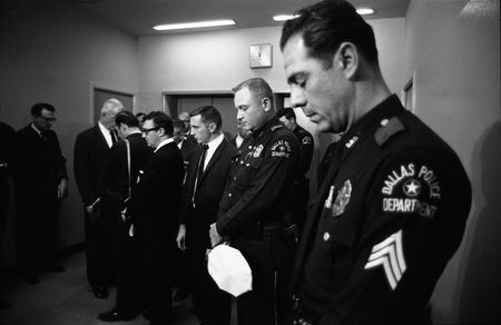 Officers and detectives from the Dallas PD observe a minute of silence for their slain colleague, J.D. Tippit, who was killed by Lee Harvey Oswald, Nov. 22, 1963, in Dallas. (Dallas Times Herald Collection/The Sixth Floor Museum at Dealey Plaza)