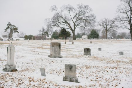 In Tulsa's Oaklawn Cemetery, only two headstones mark the graves of victims of the race massacre. The city plans to conduct a test excavation in an effort to find the remains of more of those who were killed. (Bethany Mollenkof/National Geographic)