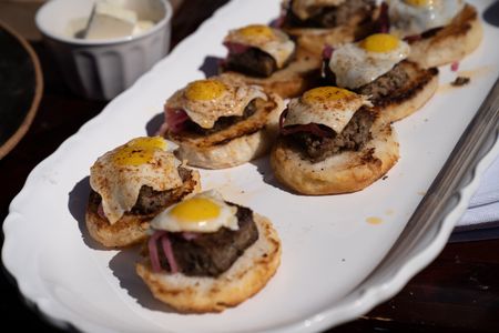 NC - Gordon Ramsay's livermush on scones topped with pickled onions and fried quail eggs. (Credit: National Geographic/Justin Mandel)