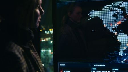 Mariana stares at the BitDefender threat map in their HQ in Romania. (National Geographic)