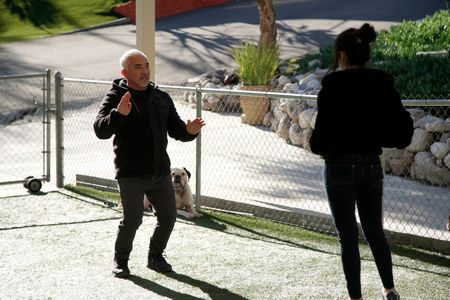 Cesar talks to Adriana at the Dog Psychology Center. (National Geographic)