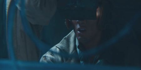 E.G McConnell (played by Rufus Shutter) looks at his target from inside the tank in a historic reenactment of the Battle of the Bulge produced for "Erased: WW2's Heroes of Color." Private First Class E.G. McConnell served heroically with the 761st Black Panther Tank Battalion in WW2. (National Geographic)