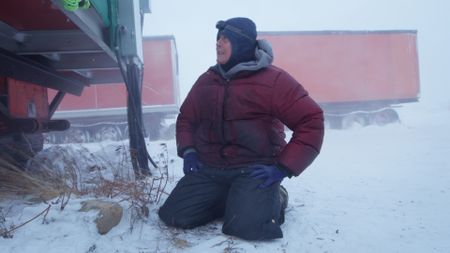 Sue Aikens fixes her camp from a severe winter storm passing through Kavik. (BBC Studios/Michael Cheeseman)