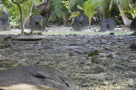 Massive stone disks found on a tropical Micronesian island in the Pacific Ocean reveal a unique trading system. (Credit: Adam Thompson)